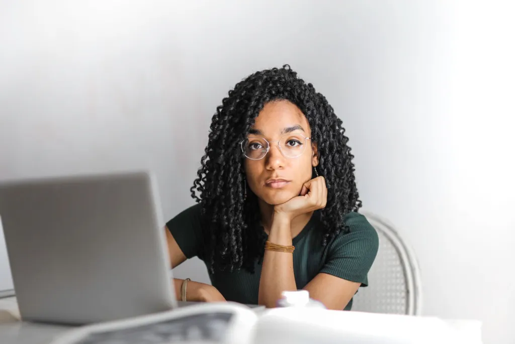 Confident woman at desk managing a normal day in period underwear