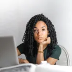 Confident woman at desk managing a normal day in period underwear