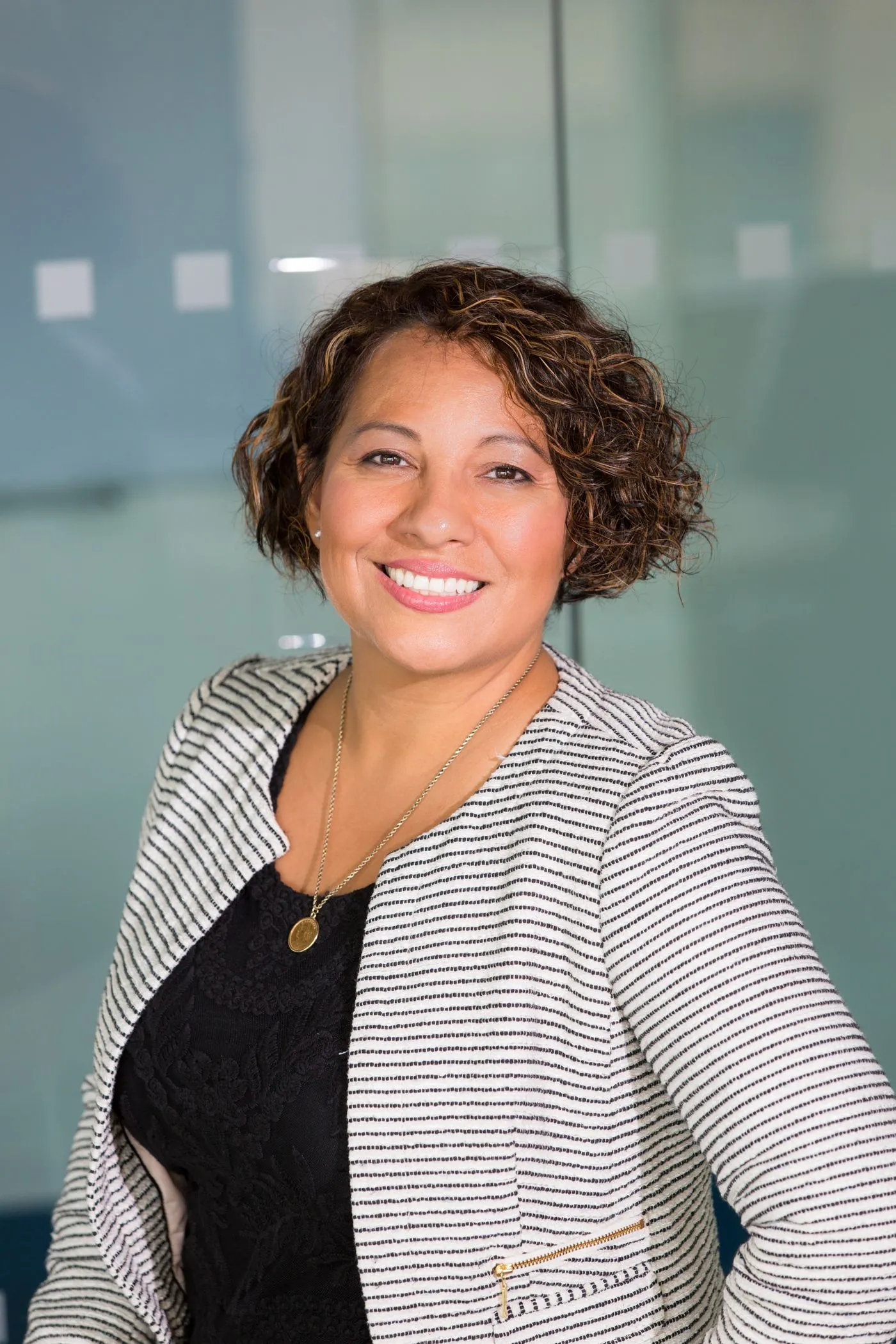 Confident woman in an everyday outfit outdoors